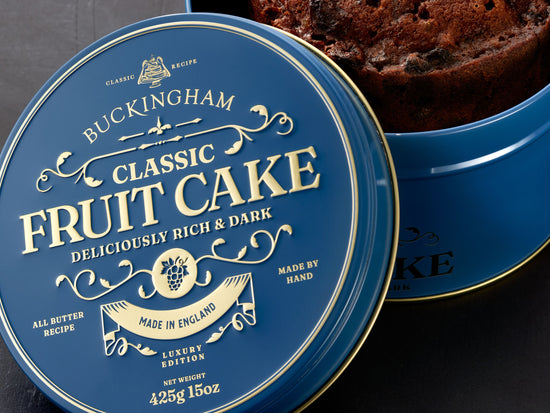 Embossed lid of gift tin containing English fruit cake
